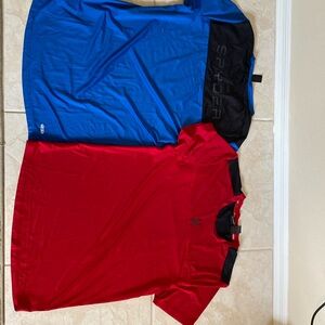 Two men’s spider activewear shirts, one in red one in blue
